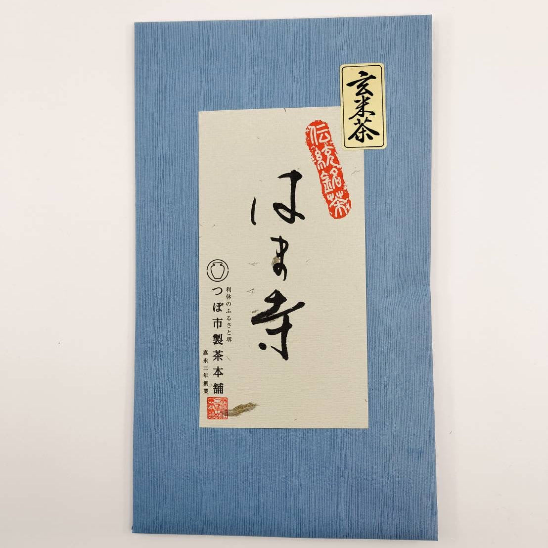 Blue packaging with a white label featuring Japanese text and a logo on a light gray background